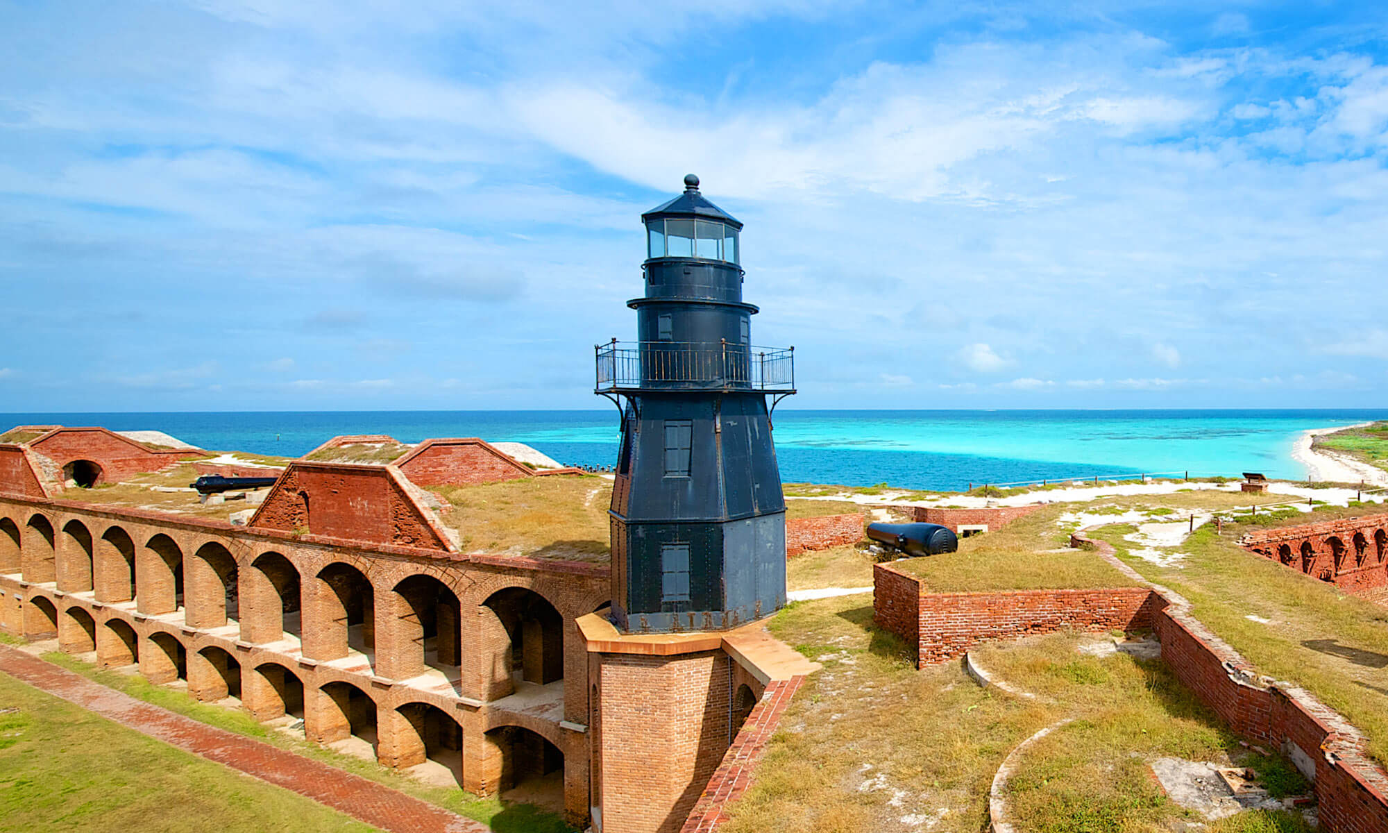 View of Fort Jefferson overlooking the ocean from behind the lighthouse at Dry Tortugas National Park