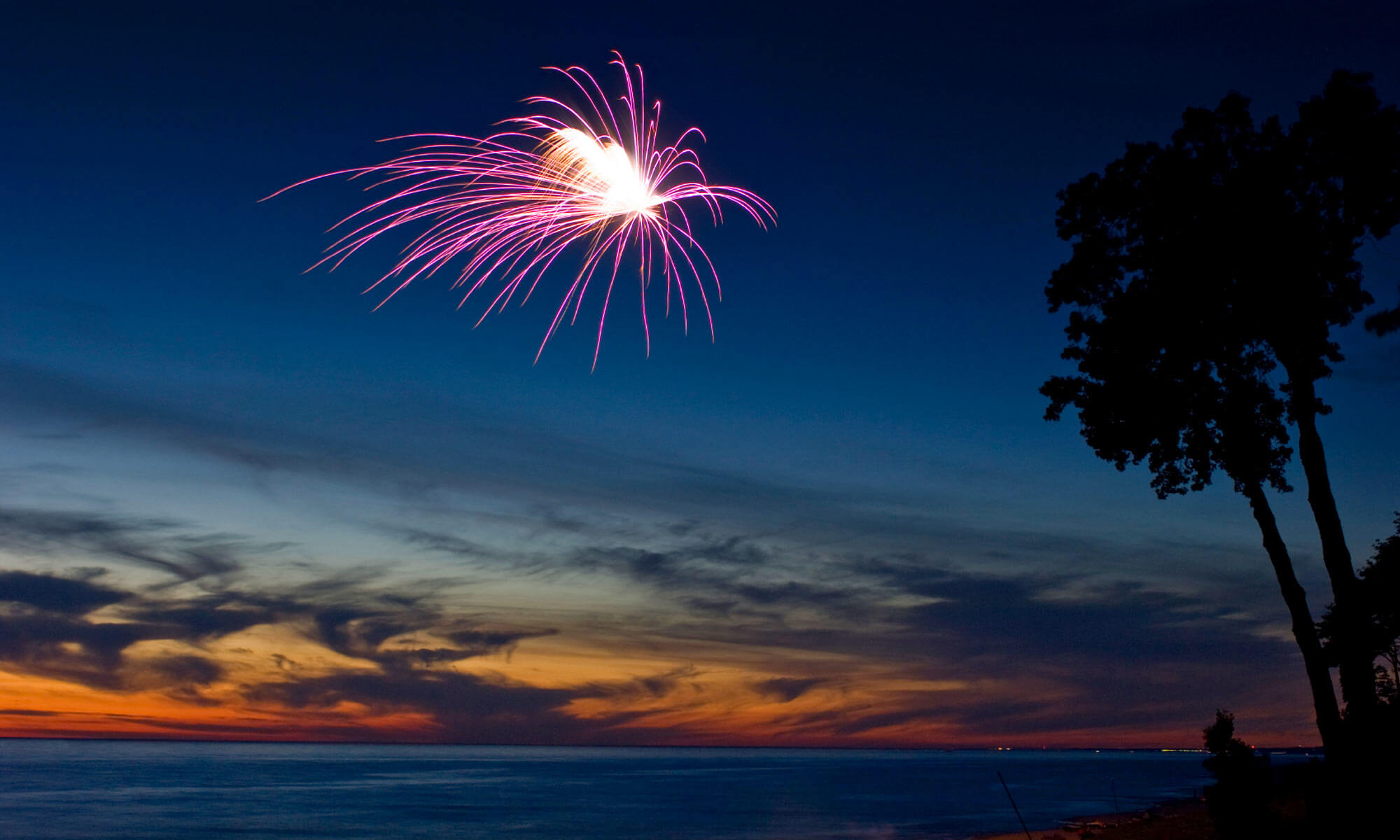 A very dramatic sunset and fireworks display off the coast of Key West, FL 