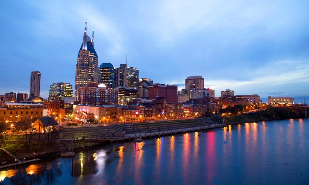 Wide angle view of Nashville, Tennessee's riverfront district at night