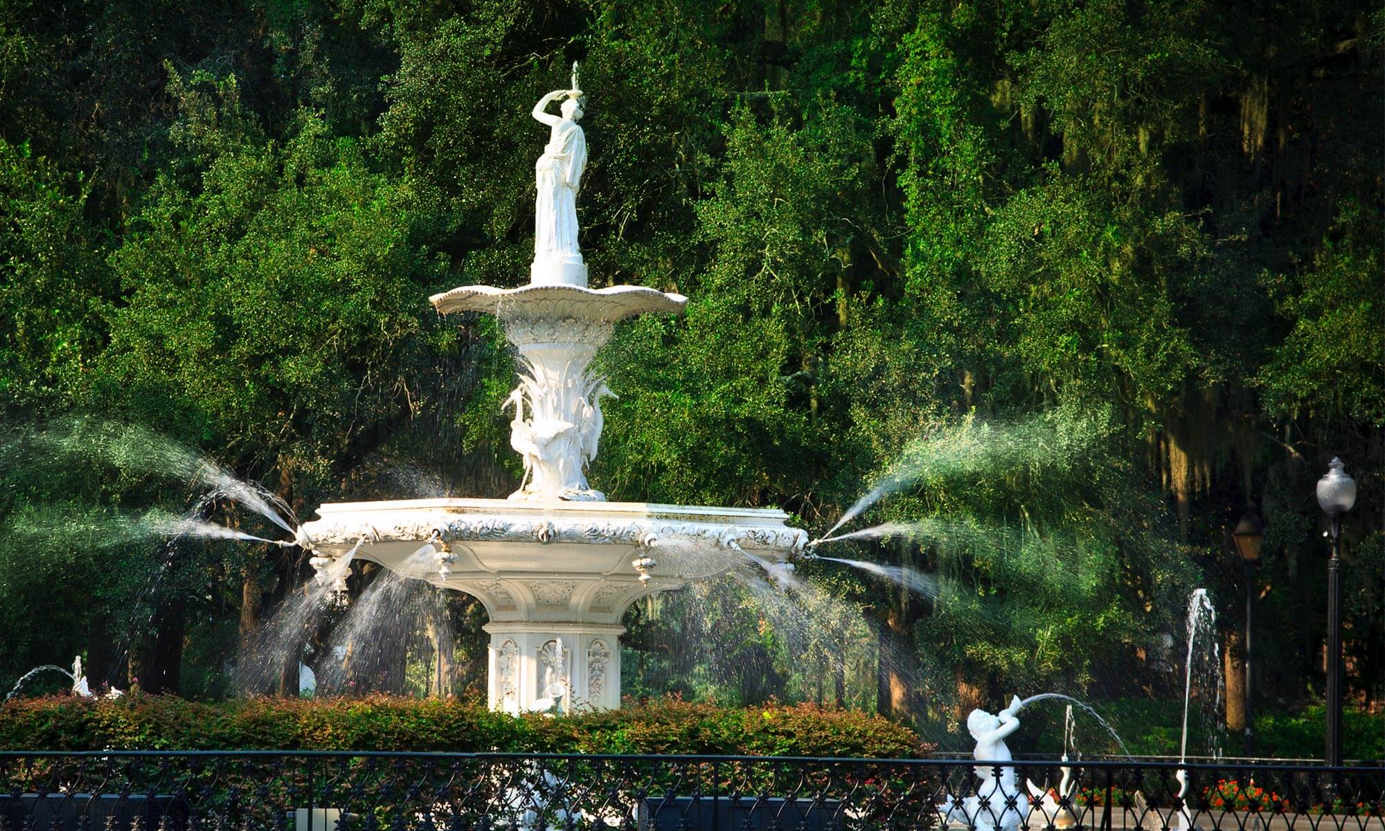 A very ornate fountain in Forsyth Park in Savannah, GA