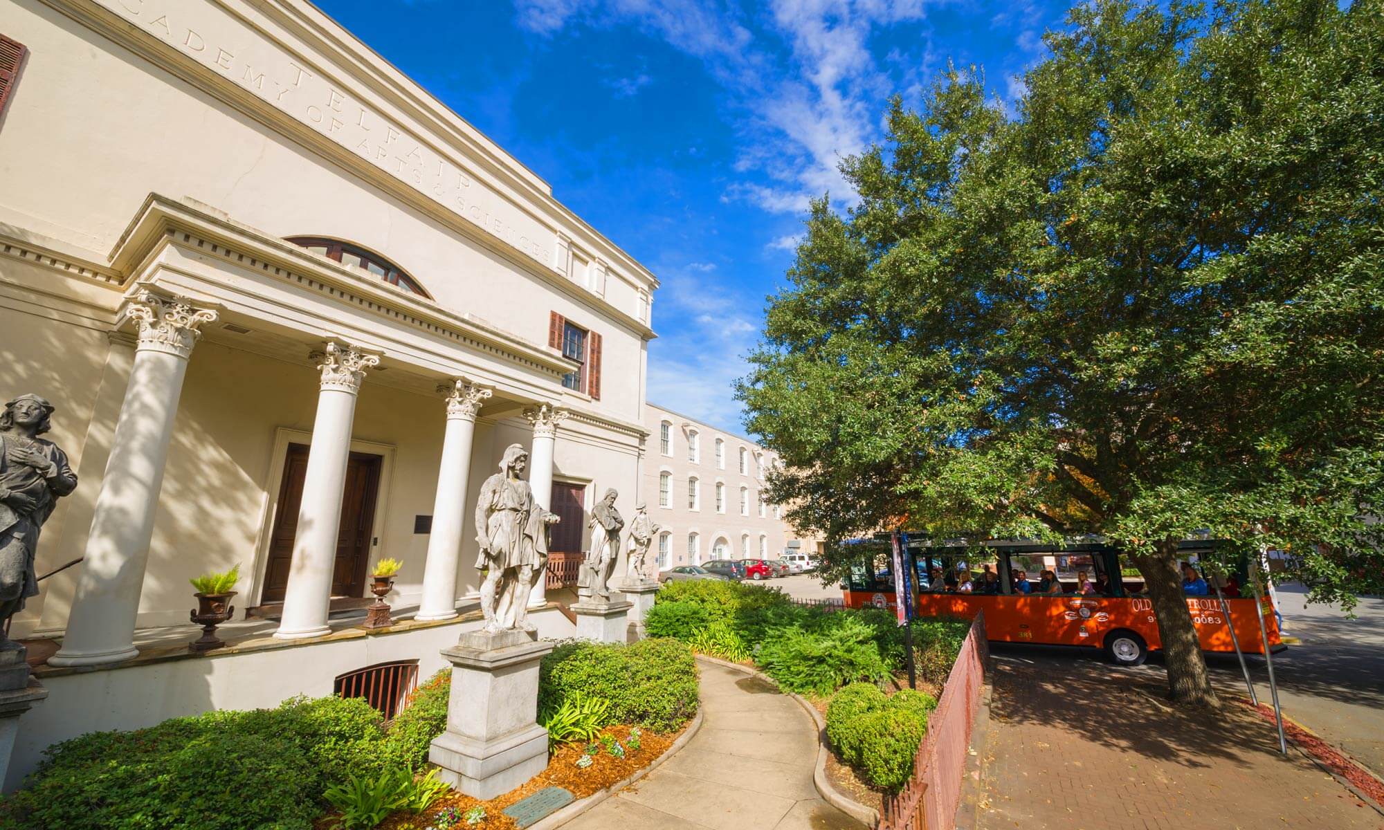 An Old Town Trolley parked in front of the Telfair Academy of Arts and Sciences in Savannah, GA