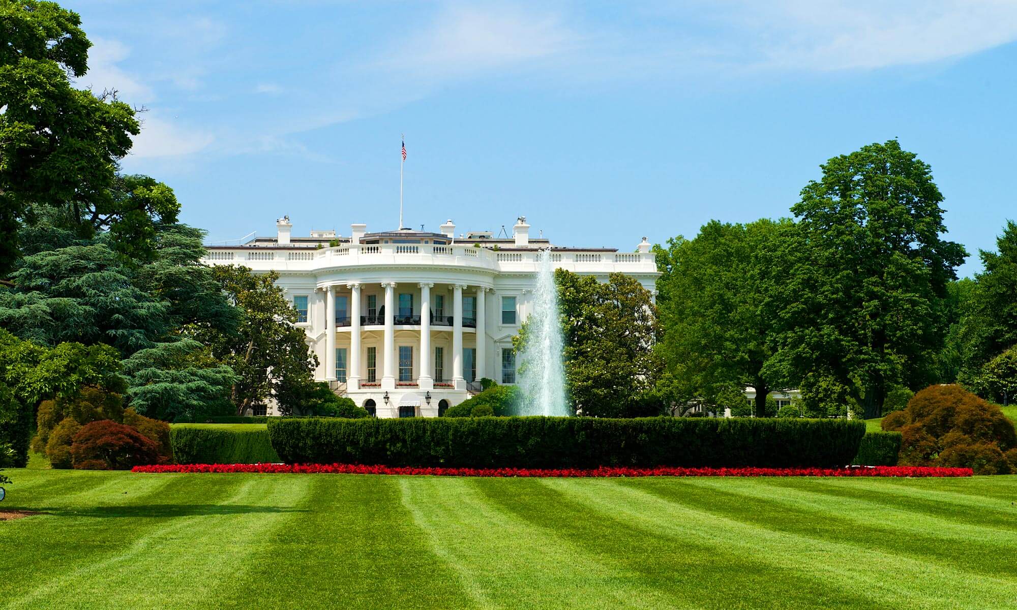 A view of the White House taken from the North Lawn where a fountain can be seen in Washington DC