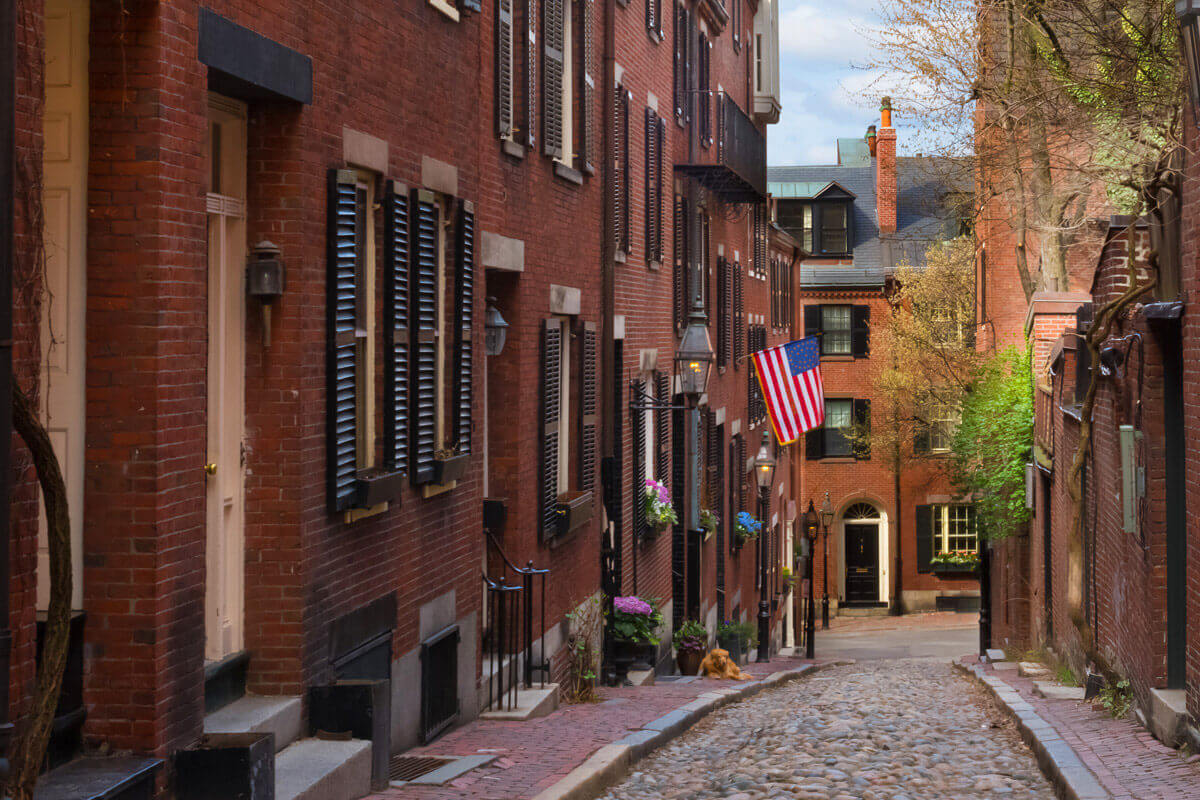 Historic Beacon Hill neighborhood in Boston with charming cobblestone streets and traditional red-brick architecture