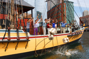 visitors dumping tea into harbor off boston tea party ship 