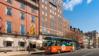 Old Town Trolley outside the famous Cheers bar in Boston, MA