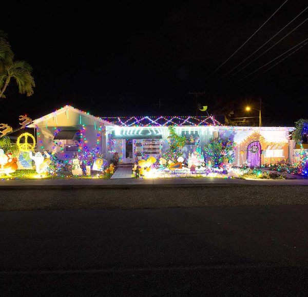 Key West house with purple and white Holiday lights