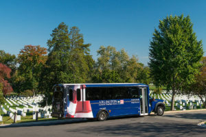 Arlington National Cemetery Shuttle driving past tombstones