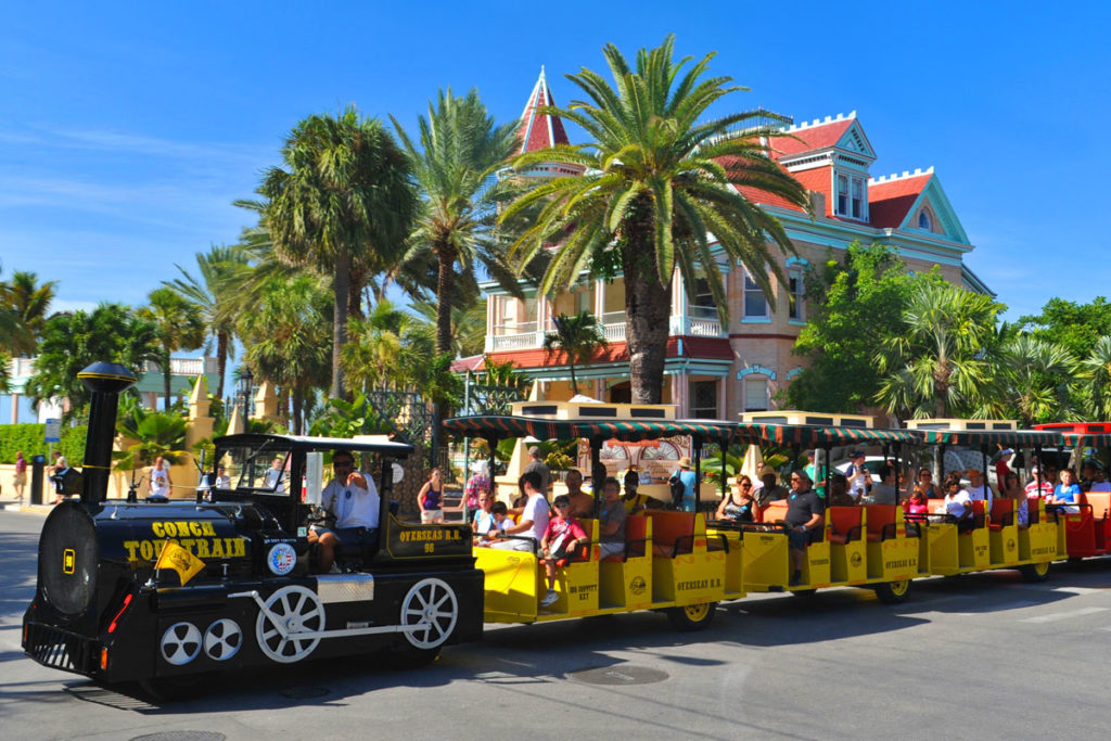 key west conch tour train driving past southernmost hotel