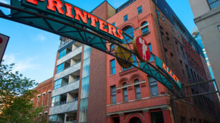 Printer’s Alley Guide - upward view of nashville printers alley street sign