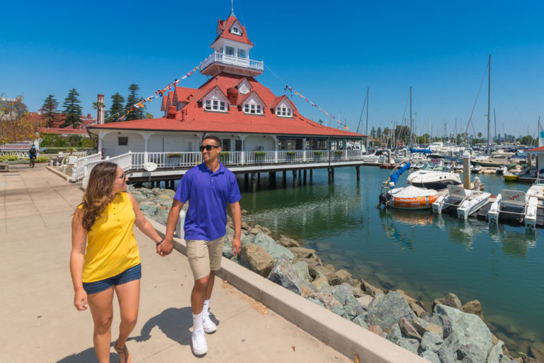 Couple walking along San Diego harbor