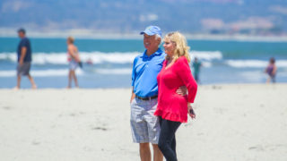 Hometown Pass - Couple walking along the beach in San Diego