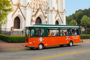 savannah old town trolley parked at cathedral st john baptist