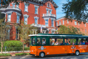 old town trolley savannah vehicle in front of kehoe house in savannah