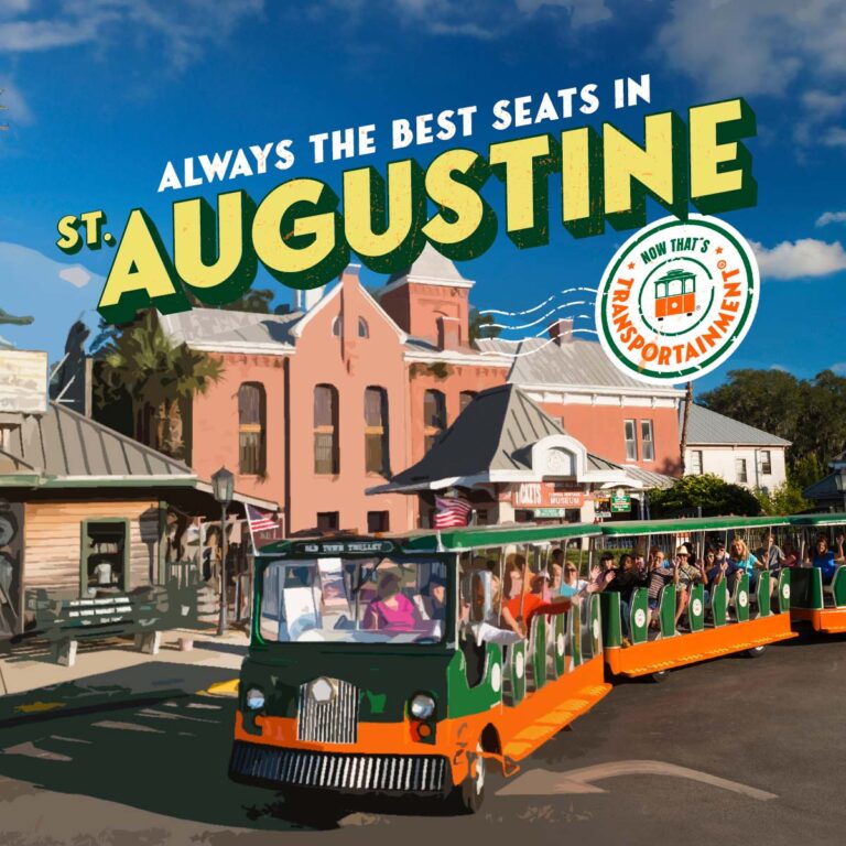 St. Augustine trolley in front of the Old Jail and the words 'Always the best seats in St. Augustine - Now that's Transportainment'