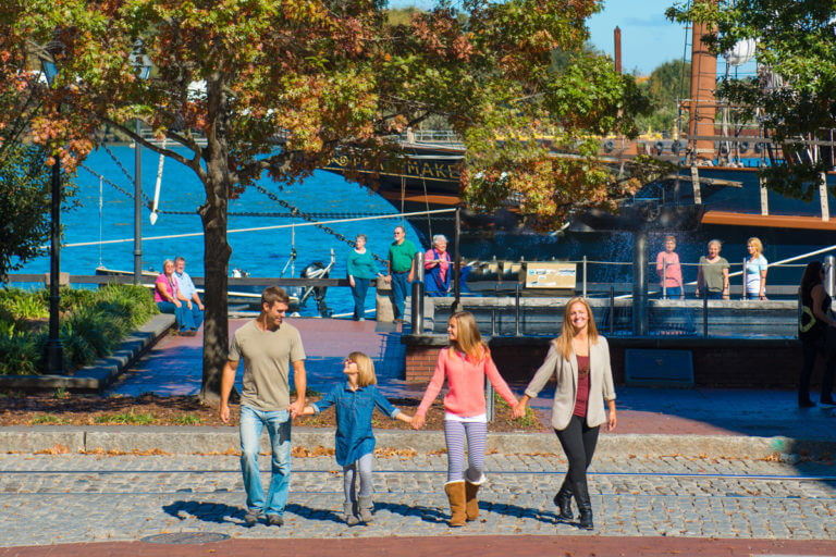 Family walking along River Street in Savannah