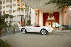 white vintage car at town and country hotel entrance