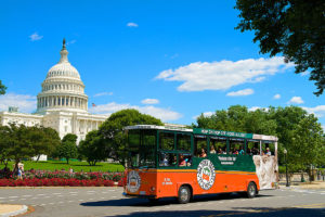 old town trolley in Washington DC driving past US Capitol building