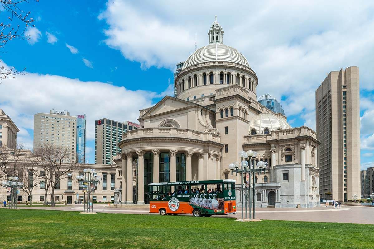 Outside the Christian Science Plaza in Boston where can be seen an Old Town Trolley in front of the Mother Church