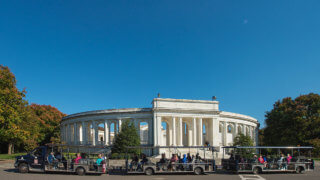 Arlington National Cemetery Tours – General Admission - picture of vehicle at Arlington National Cemetery in front of amphitheater