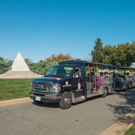 picture of arlington national cemetery tours vehicle driving past us coast guard memorial