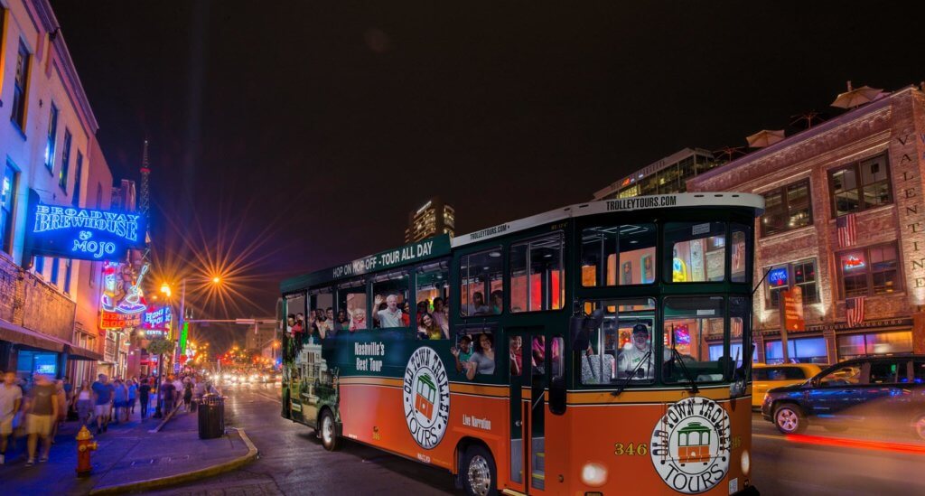 night time view of old town trolley tour vehicle on music city night tour