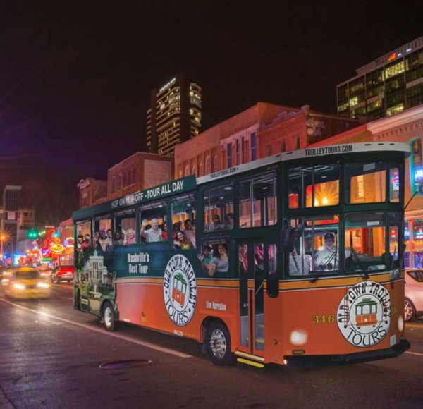 Nashville trolley driving through the city at night