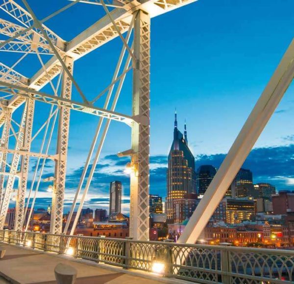 Nashville skyline through a bridge at night