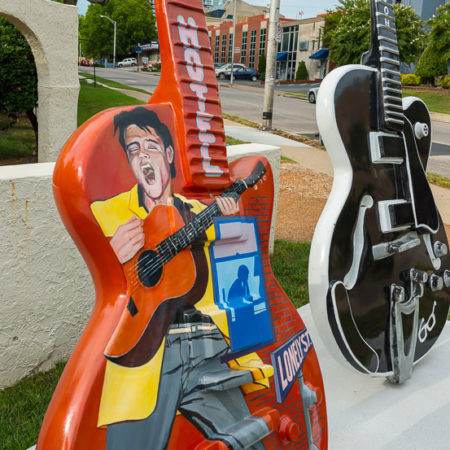 Elvis painting on a guitar