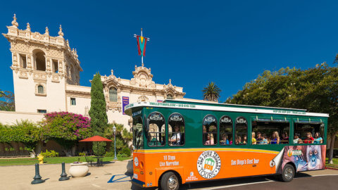 picture of san diego trolley in front of balboa park house of hospitality