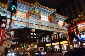 entrance to chinatown in washington dc lit up at night