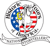 Historic Tours of America Logo that is round. Inside the circle are stars and stripes and over those, an illustration of a horse being ridden by Paul Revere holding a lantern. Around logo are the words 'Historic Tours of America' and 'The Nation's Storyteller'.