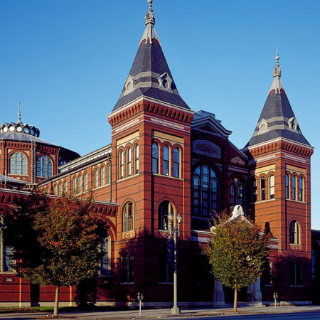 exterior picture of Washington DC arts & Industries building made of bricks, multiple windows and two towers