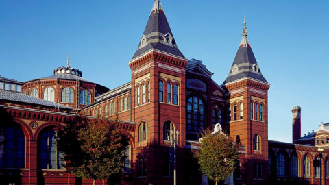exterior picture of Washington DC arts & Industries building made of bricks, multiple windows and two towers