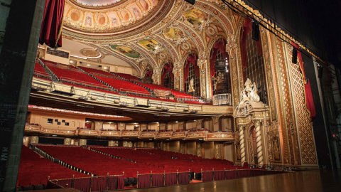 view of boston boch center wang theatre from the stage featuring two levels of seating, a stage and ornate ceiling and walls