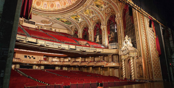 view of boston boch center wang theatre from the stage featuring two levels of seating, a stage and ornate ceiling and walls