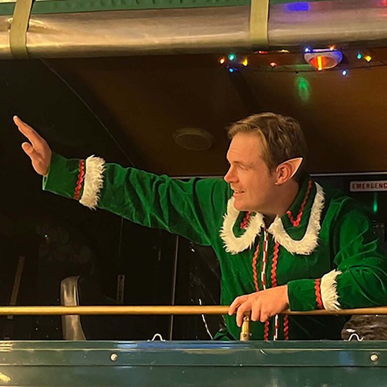 San Diego holiday tour elf host waving