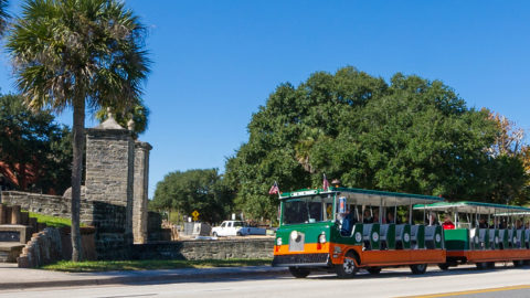 St. Augustine trolley driving past old city gates