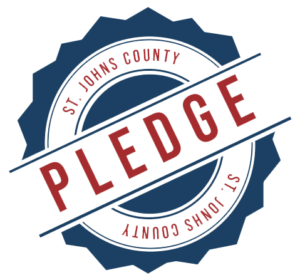 logo made up of a round seal and the words 'St. Johns County Pledge'