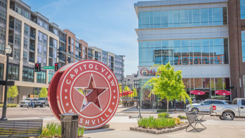 picture of Nashville neighborhood with a round sign that reads 'Capitol View Nashville'