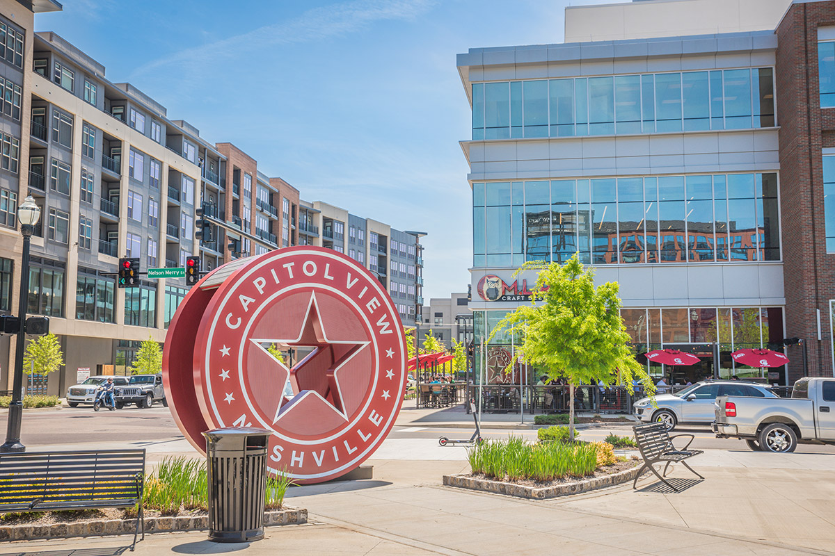 picture of Nashville neighborhood with a round sign that reads 'Capitol View Nashville'