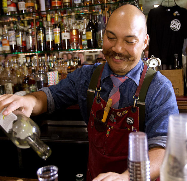 bartender pouring whiskey at savannah whiskey tasting class