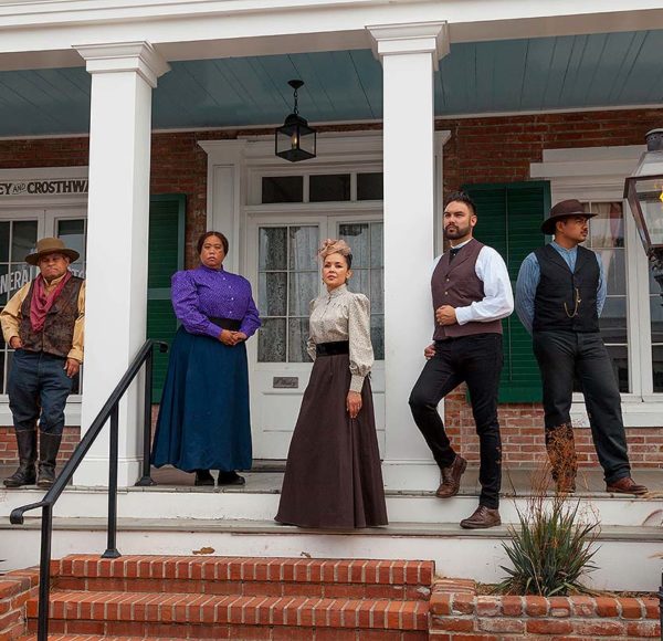 Whaley House cast members standing outside house