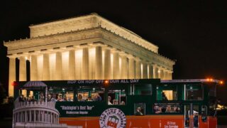 Monuments by Moonlight trolley in front of Lincoln Memorial and the words National Mall Views