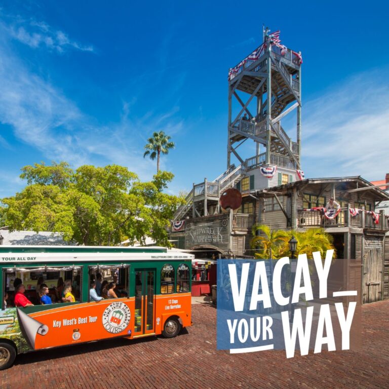 Key West trolley in front of Shipwreck Treasure Museum and the words 'Vacay Your Way'