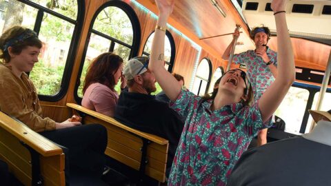 Savannah for Morons tour guides entertaining guests inside trolley