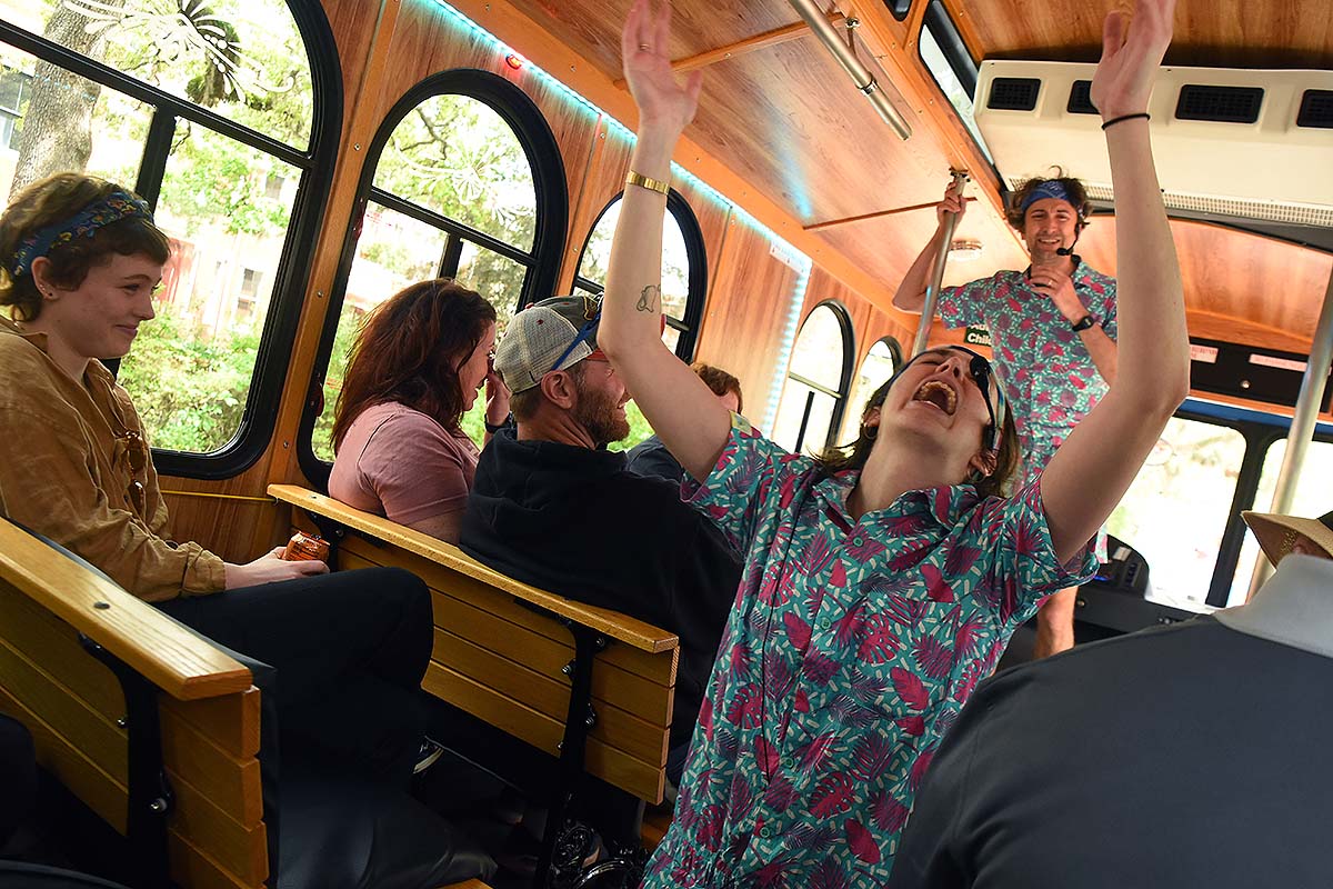 Savannah for Morons tour guides entertaining guests inside trolley