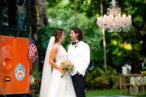 bride and groom next to trolley