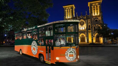 San Antonio City Lights Night Tour trolley in front of San Fernando Cathedral