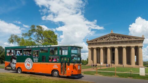 Nashville trolley driving past Parthenon