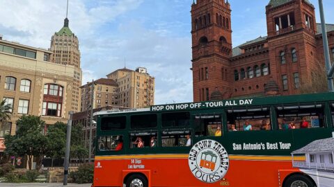 San Antonio trolley driving past Bexar Courthouse